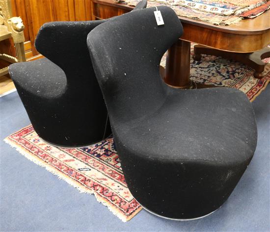 A pair of black back-to-back Italia Grande Papil chairs designed by Naoto Fukasawa